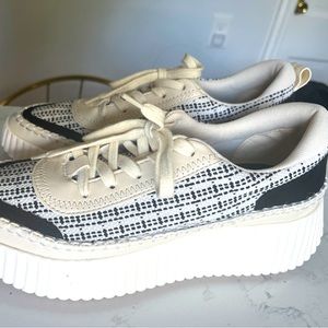 New sneakers . Never worn. Dolce Vita . Beautiful fabric . Comfy and thick sole.